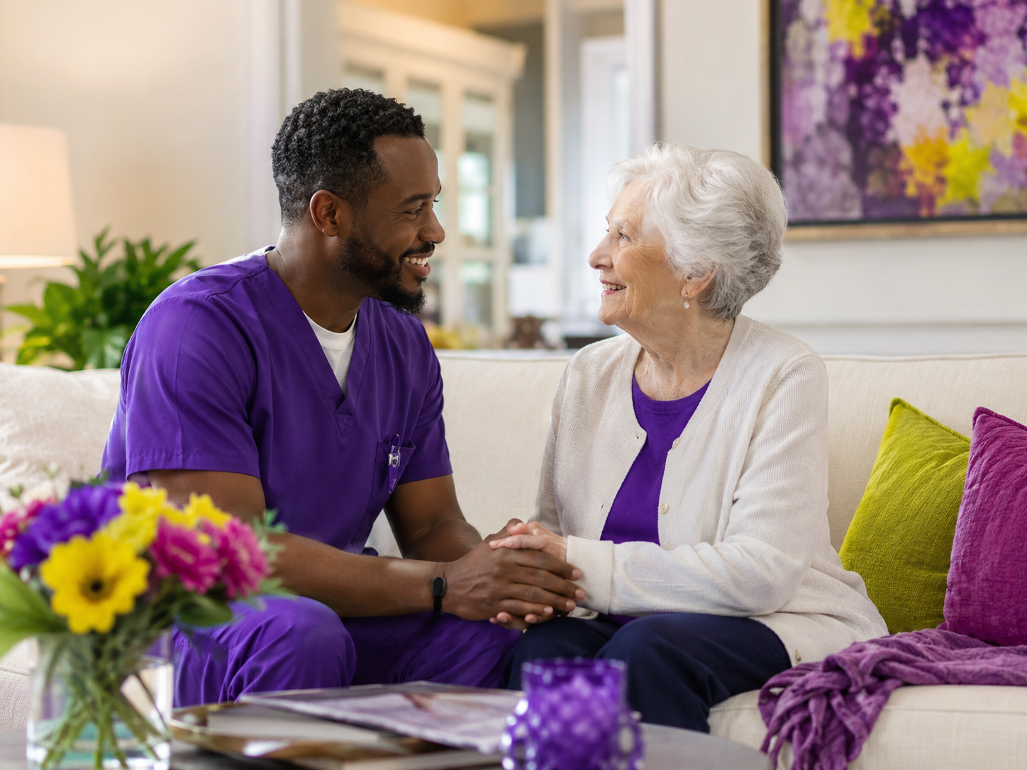 Caregiver sitting with senior client - genuine care